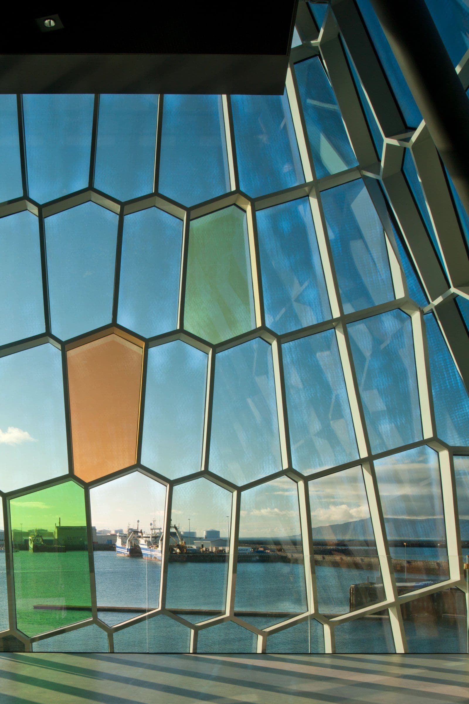a building with a lot of windows looking out to the water