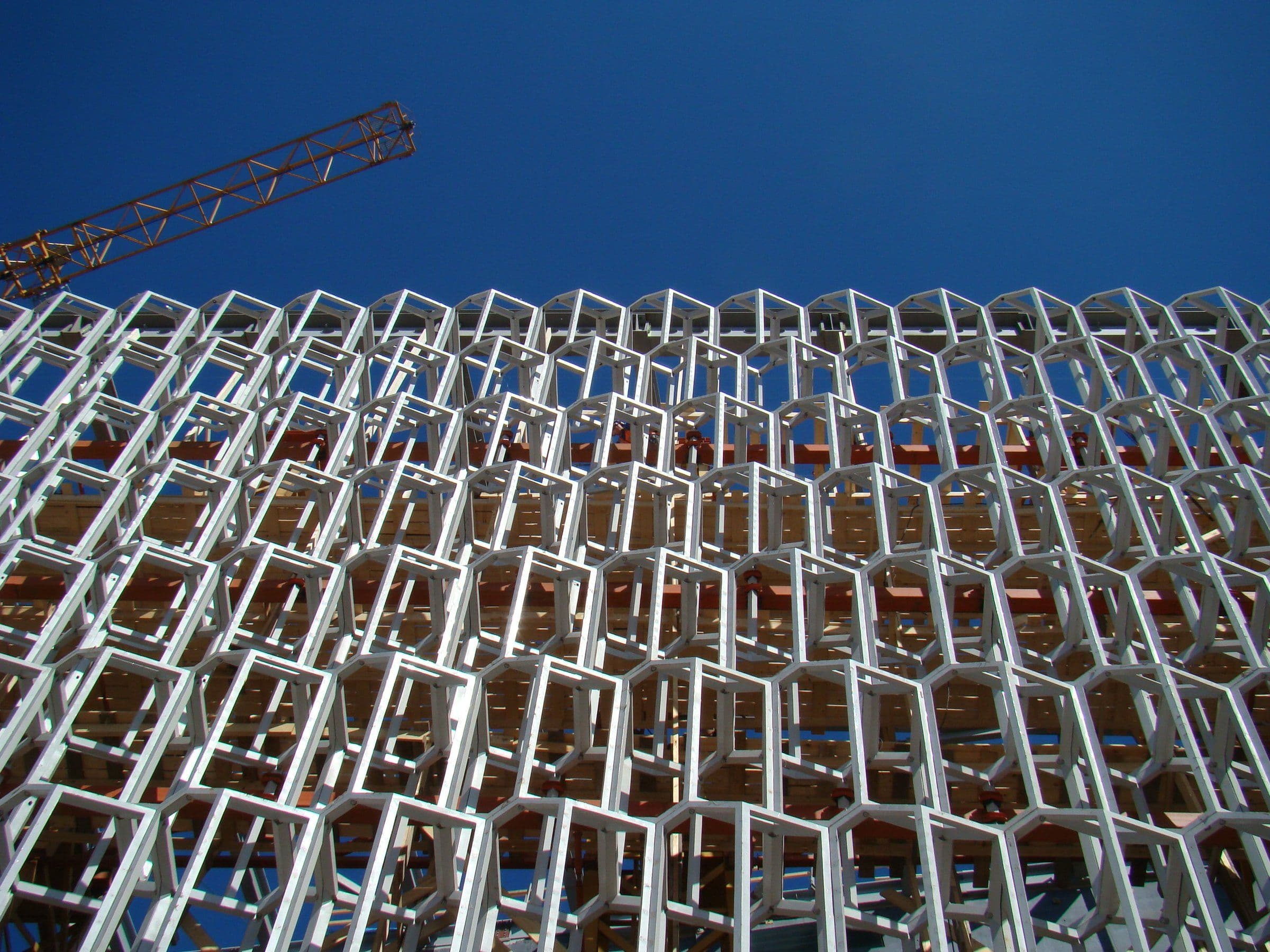 a building under construction with a crane in the background .